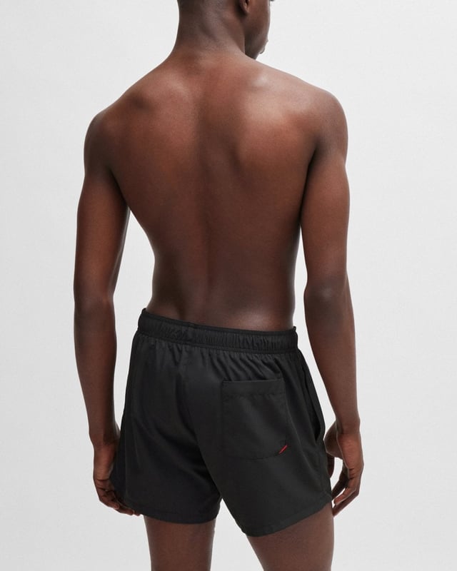 Modern swim shorts by HUGO. Designed in quick-drying fabric with full lining, this beach-ready pair features a vertical logo printed in contrast.
100% Polyester (recycled) , Lining: 100% Polyester
50513979