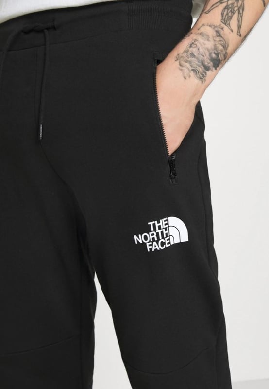 The North Face Himalayan Zipped Tracksuit.
Cut and Sew Design.
Front Zip Fastening, Long Sleeves, Fitted Cuffs and Chest Logo Embroidery.
It's Not Just Super-soft and Comfortable. 
Joggers Comes With Front Zippered Pockets, Logo Print on the Front, Print on the Back.