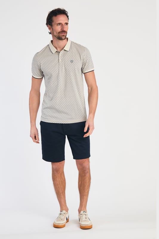 This textured cotton polo shirt from Kensington Eastside blends classic sophistication with modern design. Crafted from a premium fabric with a subtle pattern, it offers a refined yet contemporary look. Lightweight and breathable, it’s a versatile choice for smart-casual occasions, ensuring style and comfort effortlessly.