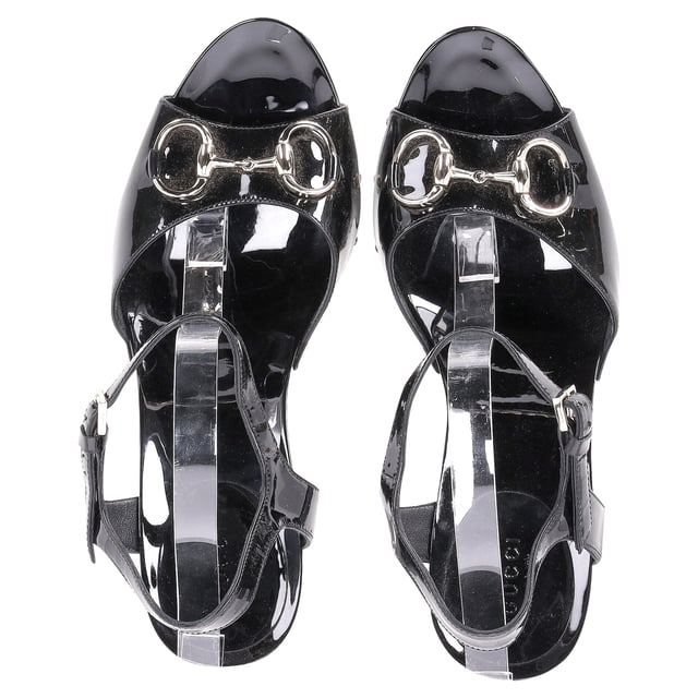 VINTAGE, RRP AS NEW
Step into timeless elegance with the Gucci Horsebit Sandal Heels in Black Patent Leather. These stunning heels feature the iconic Gucci horsebit detail, exuding classic sophistication with a modern twist. The high-gloss patent leather finish adds a layer of refined luxury, making them perfect for elevating any outfit from day to night. With their sleek silhouette and versatile black color, these sandal heels are a must-have addition to any fashion-forward wardrobe.

Gucci Horsebit Sandal Heels in Black Patent Leather

Condition: Excellent
Signs of wear: No visible sign of wear. No Mark at insole.,  Very light mark at soles.
Packaging: Dust bag
Color: Black
Material: Leather | patent leather
Size: EU41/IT41/FR42/UK8/US11
Measurements: Heel height: 130; Insole length: 270
SKU: NAPPUDESH375860W