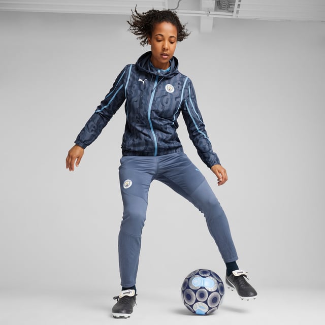 PUMA Womens Manchester City Pre-match Woven Jacket PRODUCT STORY: Train like the champions in this official Manchester City Pre-match Woven Jacket. With a regular-fit, full-zip closure, zipped pockets and our sweat-wicking dryCELL tech, it's tailored for optimal pre-match focus. It features Manchester City details, so you can represent the team with pride. FEATURES & BENEFITS: dryCELL: Performance technology designed to wick moisture from the body and keep you free of sweat during exercise; Made with at least 50% recycled materials. DETAILS: Regular fit; 80 gsm, Plain weave; Long sleeves; Full-zip closure; Zipped pockets; Official team branding. Our model is 174 cm tall and is wearing size S UK.
