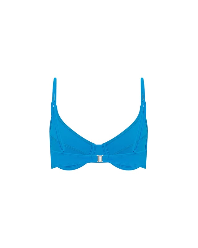 Our signature LET'S SWIM shark logo takes centre stage on this bikini top. Presented in oceanic blue, it combines style and function with its unique balconette silhouette, offering fuller coverage and wired support. Whether you're catching waves or sun rays, this top empowers strength and confidence with every wear. Pair with the matching hipster bikini bottom to complete the ensemble.