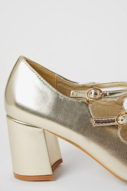 High-shine metallic finish
Block heel for stability  
Almond toe shape
Double Mary Jane straps with buckles
Reinforced heel cap for durability

These versatile metallic court shoes from Dorothy Perkins are perfect for both day and evening wear. Their contemporary double strap design with silver-toned buckles lends visual interest, while the mid-height block heel offers comfort and stability. 

Pair with cropped trousers or a flared skirt for a smart daytime look. For evenings out, match with a dress or trousers to complement the metallic shine. The reinforced heel cap gives durability for all-day wear. With their sleek silhouette and modern accents, these shoes will become a go-to in your wardrobe.