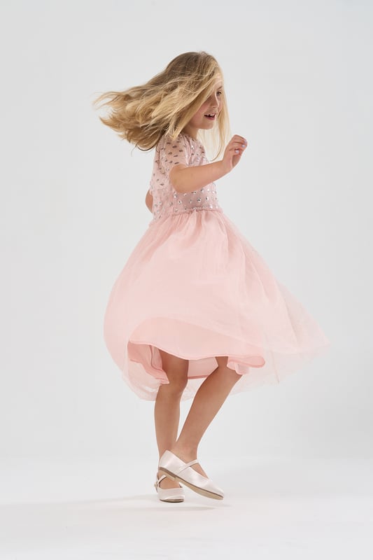 Sparkle and shine in the Luna Moon by Miss waterfall capped sleeve sequin dress! Perfect for special occasions, this enchanting dress features cascading sequins and a graceful waterfall design. Your little one will dazzle with every step.