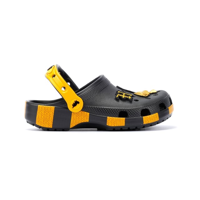 Inspired by Harry Potter’s Hufflepuff House scarf in yellow and black, these Classic Clogs are lightweight, water-friendly, and buoyant. Featuring breathable ventilation ports and pivoting heel straps for a secure fit, they're perfect for fans seeking style and comfort. Customisable exclusive Hufflepuff-inspired Jibbitz™ charms.
