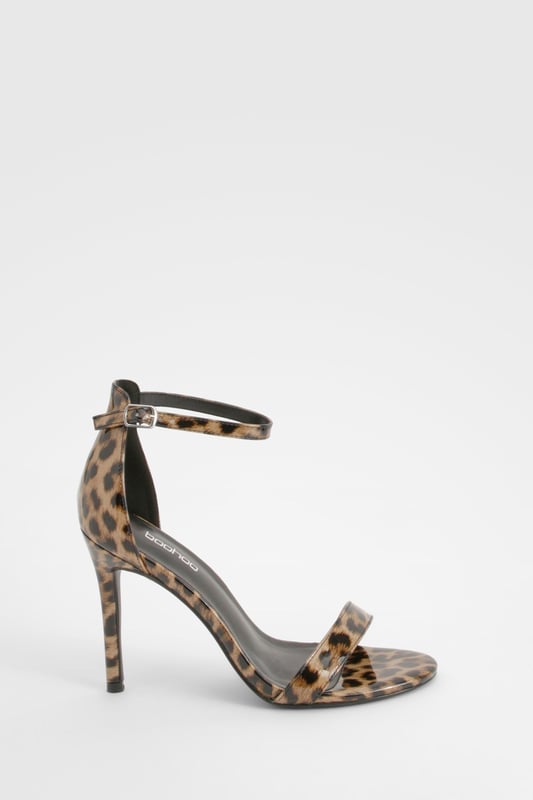 Striking leopard print design for a bold statement
        Sleek ankle strap with adjustable buckle fastening
        Elegant high heel measuring between 7 and 9cm
        Minimalist single strap across the toes for a modern look
        Versatile silhouette suitable for various outfits and occasions
    
    Make a fierce impression with these eye-catching leopard print heels from Boohoo. Perfect for the fashion-forward woman who loves to stand out, these shoes combine classic style with a wild twist. The slim ankle strap provides secure support, while the single strap across the toes keeps the design sleek and contemporary. Ideal for a night out on the town, these heels will effortlessly take you from dinner to the dance floor. Style them with a little black dress for a timeless look, or pair them with tailored trousers and a silk blouse for a more sophisticated ensemble. Whether you're heading to a cocktail party or a girls' night out, these versatile heels will ensure you're always dressed to impress.