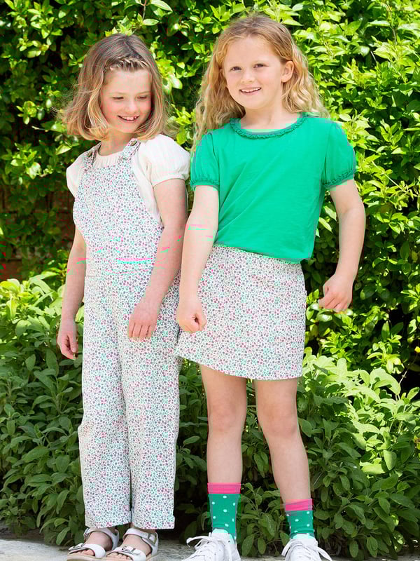 100% organic cotton | Proud to be certified to the Global Organic Textile Standard (GOTS) | Little bud all-over print | Twill fabric | Skirt with matching built-in shorts | Elasticated waistband | Made in India | Machine washable at 40 degrees, or at 30 degrees to be kinder to the planet