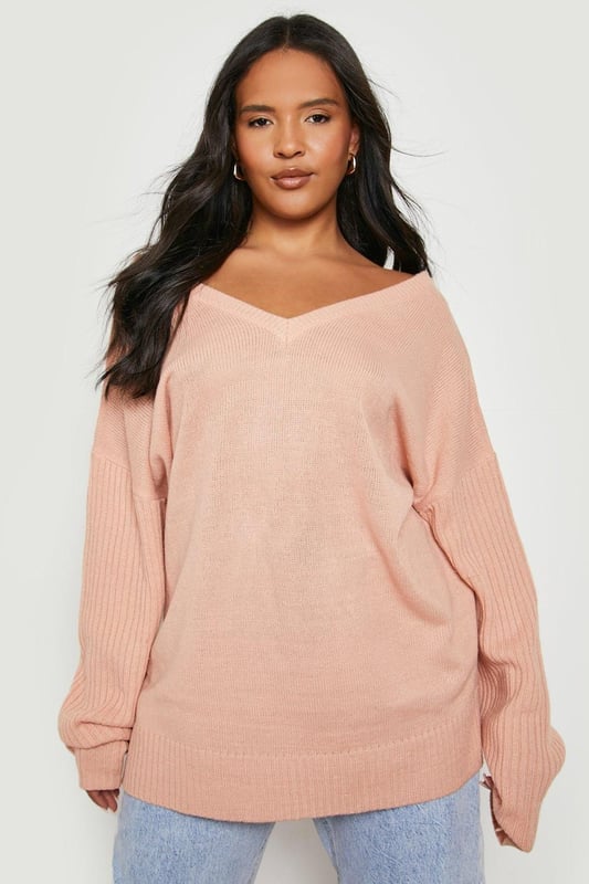 Upgrading your winter look is easy with this plus size jumper from our latest knitwear drop. Keeping you cosy with its soft fabric and knitted texture, it's perfect for layering over all your outfits, whether that's your go-to jeans or a long sleeve smock dress. Featuring long sleeves perfect for cold weather styling, this style is giving us all the cosy vibes. This season it's all about going big, so grab an  oversized plus size jumper to take your winter streetwear to new heights - just team with chunky boots and a dreamy coat.Style: JumperFabric: KnittedNeckline: V NeckSleeve Length: Long Sleeve