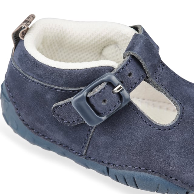 E = Narrow Fit, F = Standard Fit, G = Wide Fit, H = Extra Wide Fit.  Our iconic Baby Jack fits snug to the squarest and chubbiest of feet. In a classic t-bar design with buckle for secure fastening. Multi-width and half size fittings to give a precision fit. Delicate feet feel pampered in supple navy blue leather upper and cushioned insole. Our lightweight soles are designed for maximum flexibility and sensory feedback, perfect for pre-walkers’ needs.