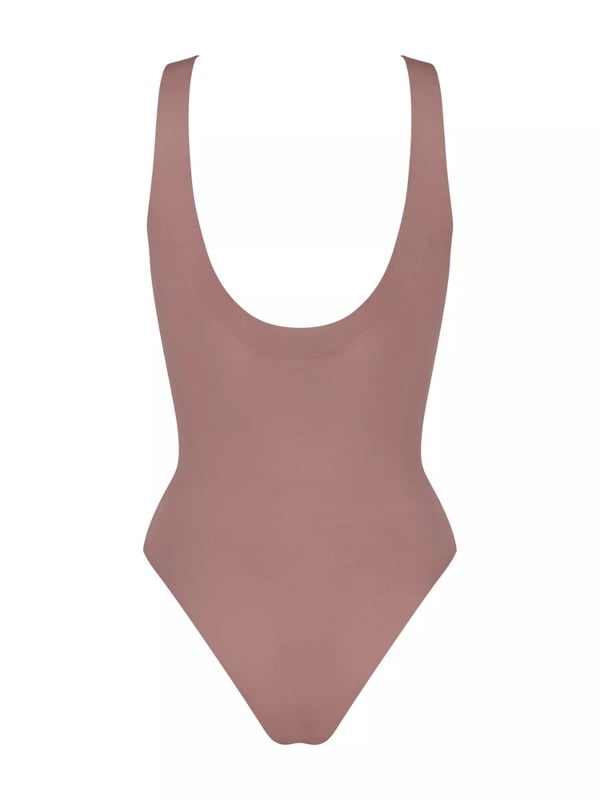Sloggi ZERO Feel 2.0 Body. Seamless and soft stretch fabric. Smooth shapewear with light compression, scoop neck, removable cup padding and closure with poppers. Product is made of 76% GRS-certified recycled Polyamide and 24% Elastane and is machine washable.