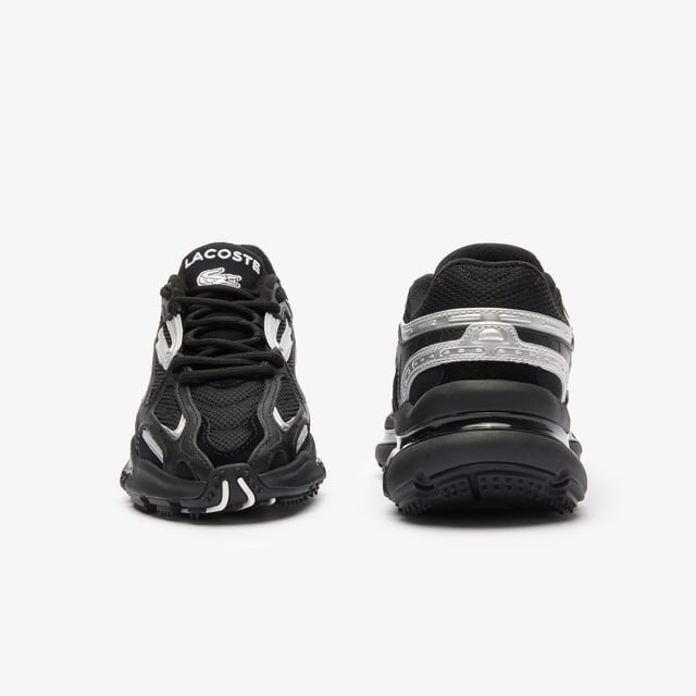 The L003 2K24 is the step to the future of Lacoste sneaker design language. This sneaker is built for today’s fashion-sneaker connoisseur - harnessing sport  style and tech features for a fresh and unique design aesthetic. The sporty mesh upper is layered with suede and multiple embossed metallic leather panels  harnessed by an outer cage which features the Lacoste Active branding details. The light EVA midsole features a dynamic shiny TPU stabiliser for support and stability together with a textured rubber outsole. • Progressive Running Sneaker • Breathable Mesh Upper with Synthetic overlays • Synthetic metallic panels with embossed detailing • Outer Synthetic Leather Cage design printed with Active Branding • EVA midsole with TPU support • Textured rubber outsole • Rounded rope laces • Mesh lining