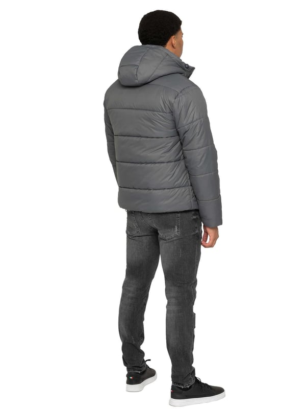 Introducing the Men's Hooded Puffer Jacket—a perfect blend of warmth and style. Featuring a high-neck design and long sleeves. The front zip-up closure offers a sleek and modern look, while the two spacious zipped side pockets provide practicality for carrying essentials. Ribbed cuffs and drawcord hem with adjustable toggle to add to the secure fit, enhancing overall comfort. Crafted from durable materials, this puffer jacket is both functional and stylish, ideal for everyday wear
•	Hooded Puffer Jacket
•	High-neck design
•	Ribbed cuffs
•	Drawcord hem with adjustable toggle