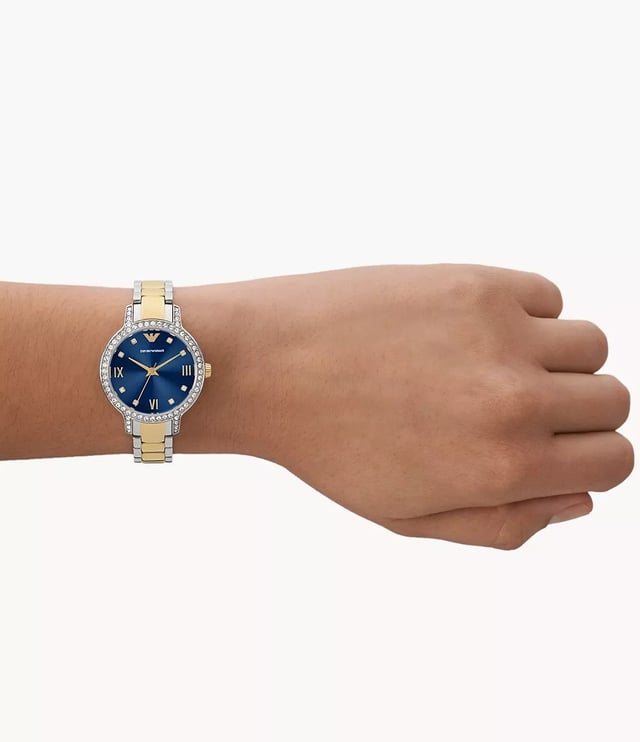 This Emporio Armani Cleo Analogue Watch for Women is the perfect timepiece to wear or to gift. It's Silver 32 mm Round case combined with the comfortable Multicolour Stainless steel watch band will ensure you enjoy this stunning timepiece without any compromise. Operated by a high quality Quartz movement and water resistant to 5 bars, your watch will keep ticking. This original fashionable watch is set with beautiful stones, perfect for every Women. High quality 19 cm length and 12 mm width Multicolour Stainless steel strap with a Deployment clasp Case diameter: 32 mm,case thickness: 7 mm, case colour: Silver and dial colour: Blue
