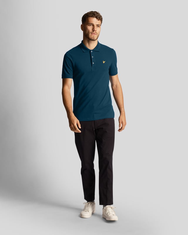 The Lyle &amp; Scott plain polo shirt is part of our Essentials range. Made from 97% cotton, it is a classic polo for a reason, made with a regular fit, cuffed sleeves &amp; three-button collar.