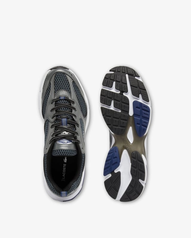 Lacoste Mens Storm 96 2K Trainers The Storm 96 2K is a creative re-imagining of the Velocity 96, Lacoste’s very first running shoe, blending 2000s running designs with modern, lifestyle-centered features. With dynamic lines and bold choices of materials, including metallic elements to create a striking style.
Mesh and synthetic leather upper
TPU plate and inserts in midsole for improved support
EVA midsole for comfort and cushioning
Textured, robust, high-grip rubber outsole
Signature crocodile on center panel, heel and tongue
Upper: 59% Polyester 41% Polyurethane; Lining: 100% Recycled Polyester; Insole: 100% Polyester; Outsole: 48% EVA 43% Rubber 9% Thermoplastic Polyurethane
48SMA0071