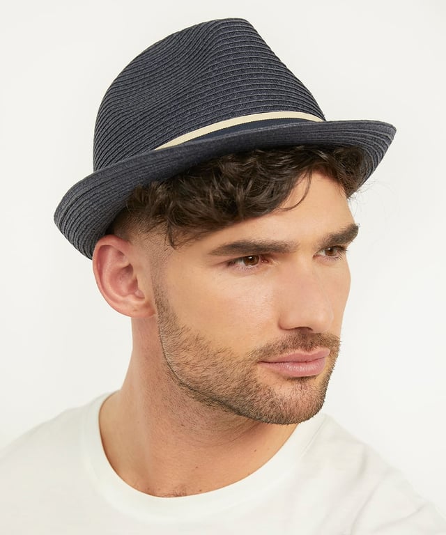 A classic style designed for warmer months, our Ohanas trilby has been finished with a navy and cream band. This stylish straw design will bring the perfect finish to any summer outfit.
