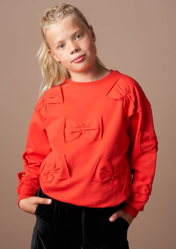 Un-bow-lievable! You are going to love our new supersoft sweat in rich crimson   with self jersey bows. Looks inc ible pai  with our tartan mesh skirt. Take a bow….