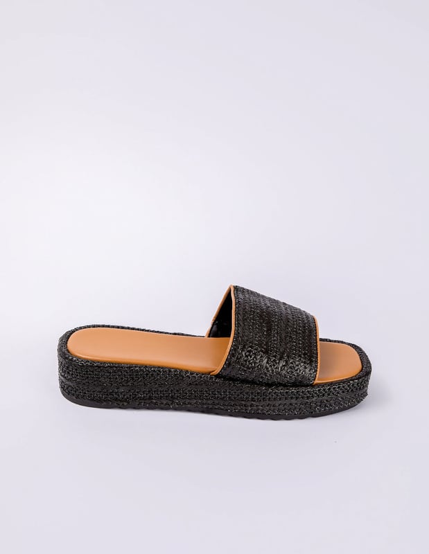 Espadrille soles and woven details make these black sandals a stylish pick on sunny-weather days. Comfort is key, and these sliders provide everything you need in a summer time slider!
