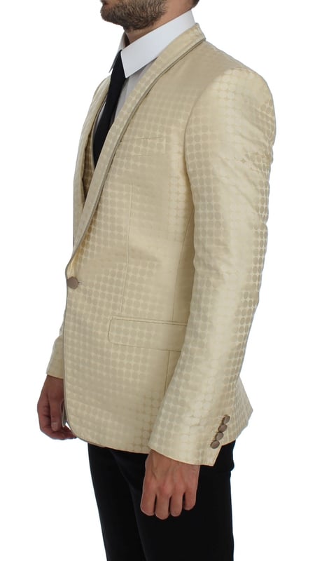 Brand: Dolce & Gabbana
  Style: 2 Piece Single breasted two button blazer and vest
  Fitting: Slim fit
  Color: Beige and gold
  Three outside pockets and two inside pockets
  One open vent in the back
  4 button closure vest with adjustable back strap
  Logo details
  Made in Italy
  Material: 58% Polyester 42% Silk
  Lining: 51% Acetate 49% Rayon
Material: 58% Polyester 42% Silk