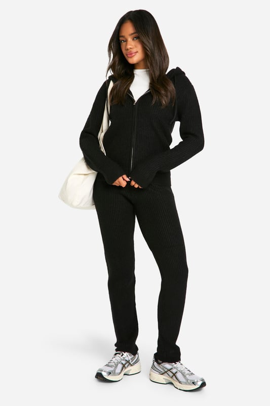 Soft fine knit texture for ultimate comfort
        Zip-through hoodie design for versatile styling
        Coordinating trousers for a complete look
        Ribbed cuffs and hem for a snug fit
        Relaxed silhouette perfect for lounging or casual outings
    
    Embrace laid-back chic with this soft fine knit tracksuit from Boohoo. The zip-through hoodie and coordinating trousers offer a seamless blend of comfort and style, ideal for those lazy weekends or casual catch-ups with friends. Layer the hoodie over a simple white tee, as shown, for a classic look, or wear it zipped up for extra warmth. The relaxed fit allows for easy movement, making it perfect for running errands or lounging at home. Pair with trendy trainers and a crossbody bag for an effortlessly cool ensemble. For a touch of athleisure, style with statement socks and slider sandals. This versatile co-ord set is a must-have addition to your casual wardrobe, offering endless styling possibilities for the fashion-forward Boohoo girl.