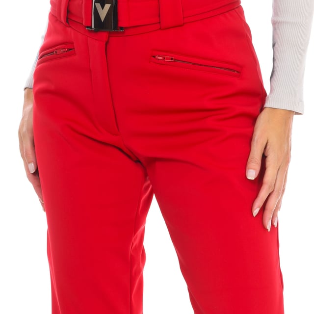 Ski pants Vuarnet.
 Adjustable belt with buckle closure.
 Front opening with zipper and snap button.
 Two zippered hand pockets
 Adjustable lower leg with zipper.
 Fixed inner gaiter with non-slip bands and reinforced material on the leg.
 Seams seen in tone.
 Composition: 82% Polyamide, 18% Elastane
 Care:
Wash at maximum temperature 30º.
 Dry at low temperature.
 Iron at low temperature.
 Do not use bleach.
 Do not dry clean.