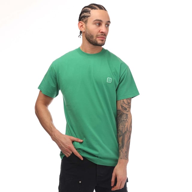 Ambush Monogram Patch T-Shirt in green.- Ribbed crew neck.- Short sleeves.- Logo patch at the chest.- Slim fit.- 100% Cotton.- Ref: BMAA0130015555