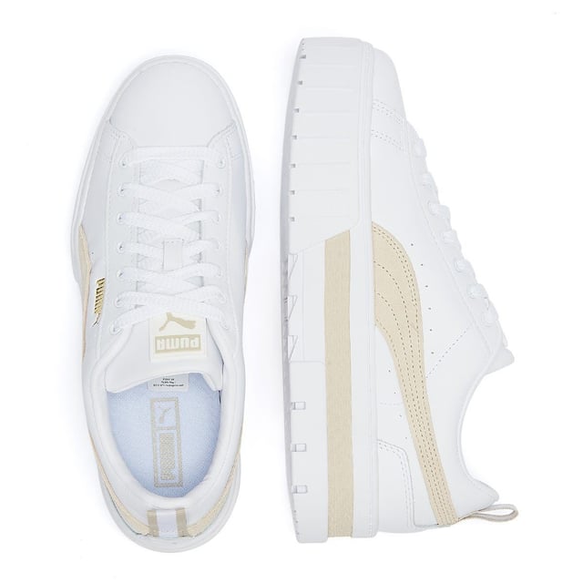 PRODUCT STORY : We made this one for the hype girls, street enthusiasts and trend mavens - basically for those who want to stand out with sophisticated swagger. Taking design elements from the urban environment and injecting them with extra edge, the Mayze encompasses attitude. Crisp and clean, with a luxurious leather upper, sleek suede overlays, eye-catching colour contrasting and a seriously stacked sole, these trend-setting trainers will be the envy of every onlooker. DETAILS : Leather upper with suede and synthetic overlays Glossy eyelets Elevated rubber midsole with textured tooling Rubber outsole Lace closure for a snug fit PUMA branding at tongue Foil-printed PUMA No.2 Logo at quarter PUMA Formstrip at medial and lateral sides PUMA Wordmark at tooling Foil-printed PUMA Cat Logo at heel