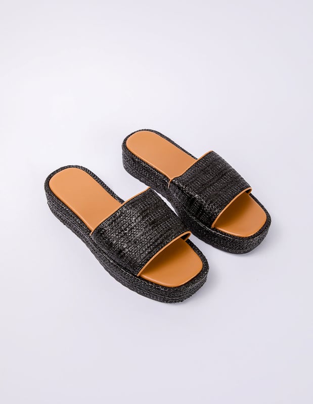 Espadrille soles and woven details make these black sandals a stylish pick on sunny-weather days. Comfort is key, and these sliders provide everything you need in a summer time slider!