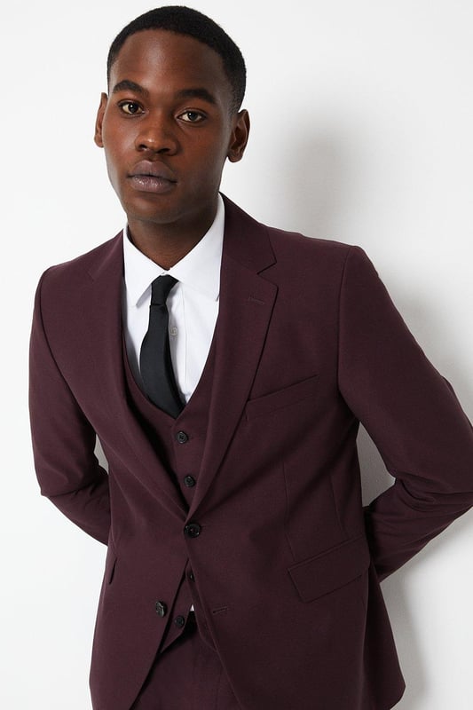 Slim, tailored fit for a sharp, modern silhouette
Two-button, single-breasted jacket with notched lapels
Sleek, streamlined design with minimal detailing
Premium, lightweight fabric with a hint of stretch
Versatile burgundy hue suitable for smart occasions

Exuding refined sophistication, this slim fit suit jacket from Burton is the epitome of contemporary tailoring. The sleek, streamlined silhouette hugs the body for a sharp, modern look that's perfect for smart casual events or formal occasions. Pair with tailored trousers and a crisp shirt for a polished ensemble that radiates confidence and style. The premium, lightweight fabric with a touch of stretch ensures a comfortable yet impeccable fit, allowing for ease of movement. Whether attending a wedding, business meeting, or evening soiree, this versatile jacket will have you looking dapper and on-trend.