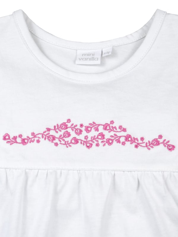 These comfortable shortie pyjamas for girls are made from soft cool cotton and feature a unique check that was created by our in-house design team. Complete with a complementary white woven top with pretty cap sleeves and dainty embroidery. The short has  fully elasticated waist with a frilled hem. They are sure to become a new bedtime favourite in the hot summer months!

Design & Fit

Classic white short sleeve top and shorts
Pretty Embroidery
Elasticated waistband
Easy, pull-on style
Fabric and Care

100% cotton seersucker
Machine wash
Safety warning: keep away from fire