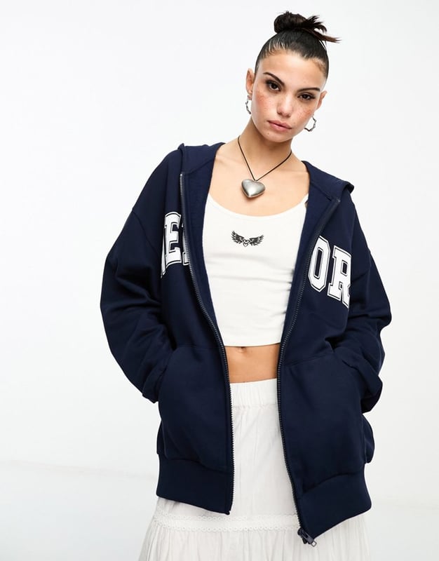 Hoodies & Sweatshirts by ASOS DESIGN Act casual Fixed hood Zip fastening 'New York' print to chest Side pockets Oversized fitSold By: Asos