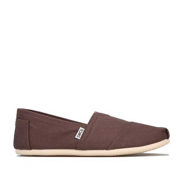 Toms Classics hereninstappers van canvas in grijs<br /><br />-Instappers<br />-Elastisch V-inzetstuk aan de voorkant voor extra comfort<br />-Rubberen EVA-buitenzool<br />-Voorgevormd voetbed voor extra demping<br />-Latex voetbooginzetstuk voor extra ondersteuning<br />- Contrasterende voering<br />-Merkdetails op de hiel en de zijkant<br />-Bovenwerk van textiel, voering van textiel en leer, zool van textiel en synthetisch materiaal<br />-Ref: 10000864