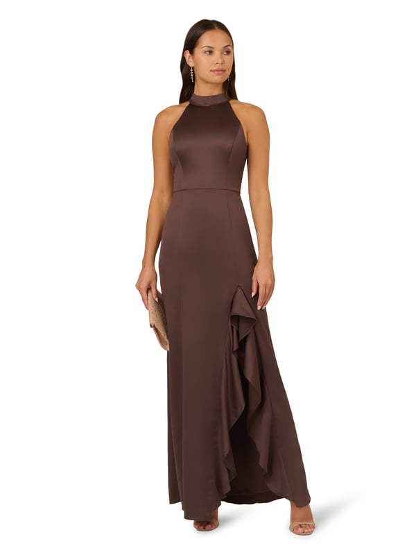 Fall for dreamy fabric and details when you select this satin mermaid gown for your next occasion. This formal dress features a sleeveless halter bodice, mock neckline, and a mermaid skirt with a slit trimmed with ruffles. Designed with satin fabric, the bodice of this formal dress has princess seams for a fit that flatters your figure. A self-tie neck adorns the cutout back and a hidden zipper closure at the centre back completes this evening gown. Paired with statement jewellery and metallic heels, this sleeveless satin gown will shine for formal and black-tie events.