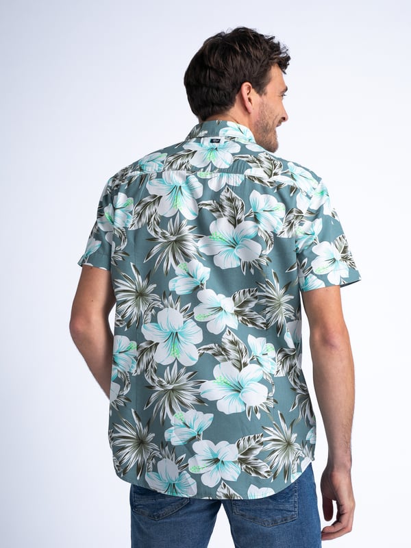 Kurzarm-Hemd mit normaler Passform. Dieses Hemd hat ein botanisches Allover-Muster, einen klassischen Kragen, einen Knopfverschluss und eine Brusttasche. Du schwankst zwischen zwei Größen? Nimm die größere Größe! Kurzarm-HemdBotanischer Allover-PrintNormale PassformKlassischer KragenKnopfverschluss55 % Baumwolle, 45 % LyocellDas Model ist 191 cm groß und trägt Größe L.
