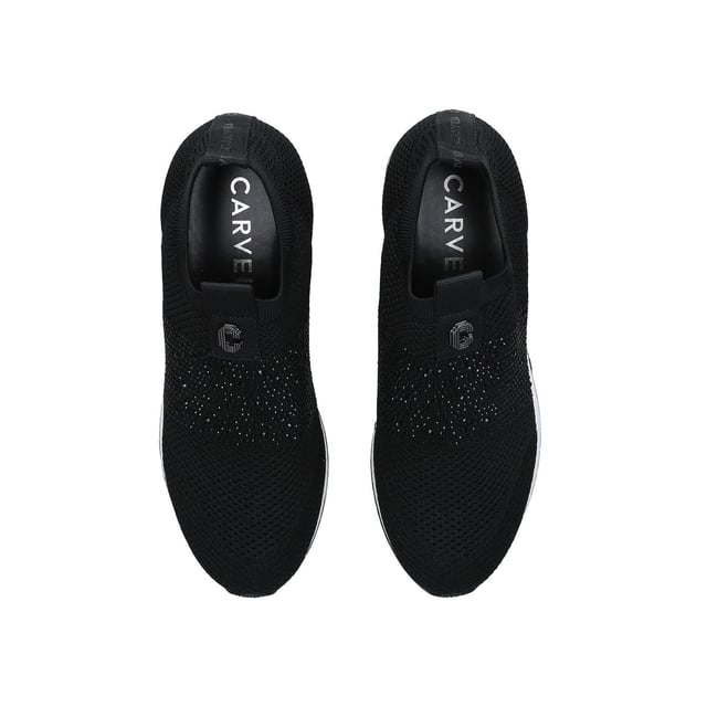 The Carvela Janeiro2 trainer features a black knitted upper in a low top sock-style. There is a black crystal embellishment across the toe with Icon C metal stud.