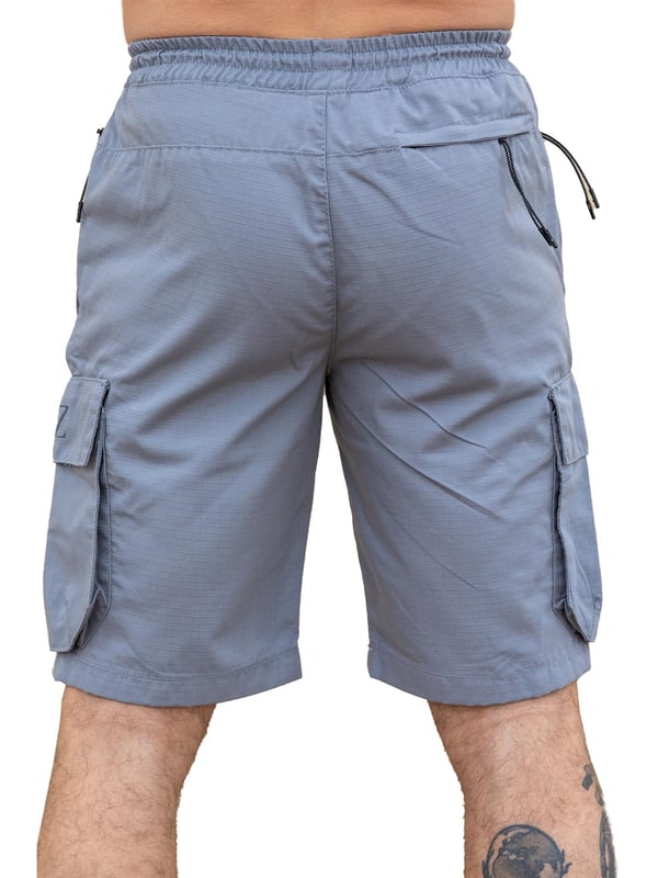 Expertly designed with top-quality ripstop fabric, these Enzo technical cargo shorts offer unparalleled durability. The convenient cargo pockets and zip side pockets make for easy storage, and the elasticated waistband with an adjustable drawstring ensures a comfortable fit. Upgrade your wardrobe and gear with this must-have for any outdoor enthusiast.