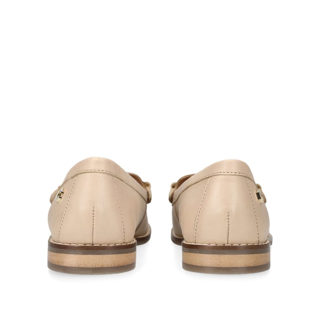 The Snap is a slip on loafer crafted from a blush leather. The gold tone horsebit detail sits across the toe of the shoe. There is a small gold tone Icon C at the outer heel.