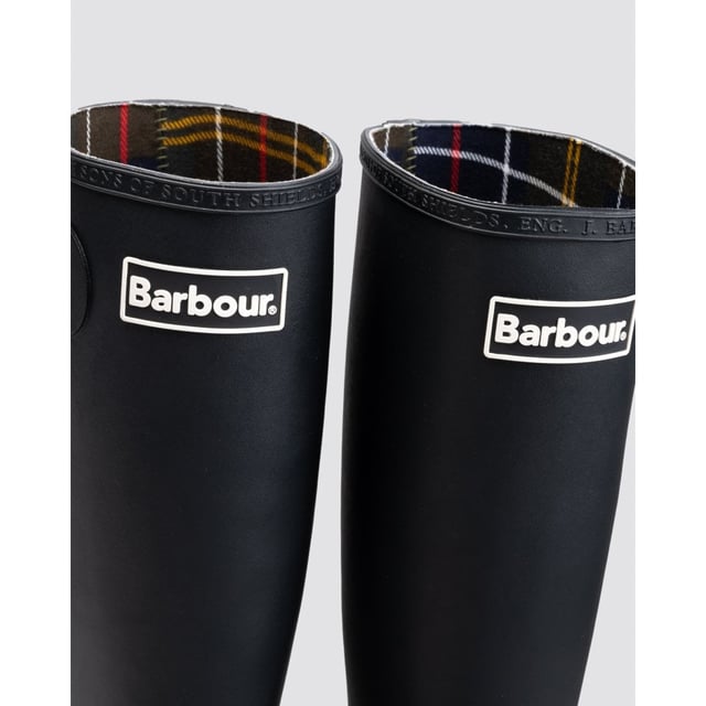Bede Ladies Wellington Boots The Barbour Bede Wellington Boots are constructed with the classic rubber outer, chunky non-slip sole and a cotton twill inner that's both lightweight and durable. Finished with a rubber Barbour badge to the top of the leg.
100% Rubber outer
100% Cotton twill inner
Barbour branded rubber patch