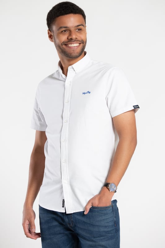 Elevate your casual style with this oxford shirt from Tokyo Laundry. Made from 100% cotton, this short-sleeved shirt is perfect for any occasion. The classic design features a comfortable fit and button fastening. Add this versatile staple to your wardrobe today. Machine washable for easy care.