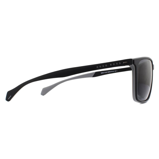 Hugo Boss Sunglasses 1114/S O6W IR Dark Grey Grey are a classic and versatile rectangular style made entirely of lightweight plastic. The outer edge of the frame front is coloured to match the Hugo Boss lettering on the temples and the inside of the temple tips.