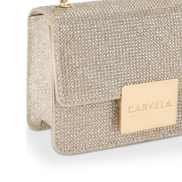 The Carvela Mini Bee Cross Body arrives in gold glitter fabric embellished with crystals. The front flap is fastened with a gold branded plate. 12cm (H), 17cm (W), 6cm (D). Strap drop cross body: 113cm.
