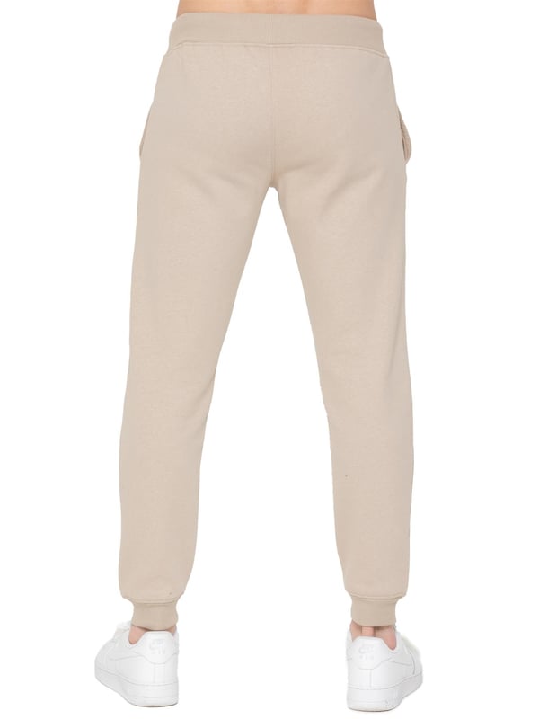 Upgrade your casual wardrobe with these Men's Slim Fit Joggers from Only. Designed for both comfort and style, they feature an elasticated waist with a drawstring for a customizable fit. The Enzo logo is elegantly embroidered on the leg, adding a touch of refinement. With a practical 2-pocket design and fleece lining, these joggers combine functionality with warmth, making them perfect for everyday wear.