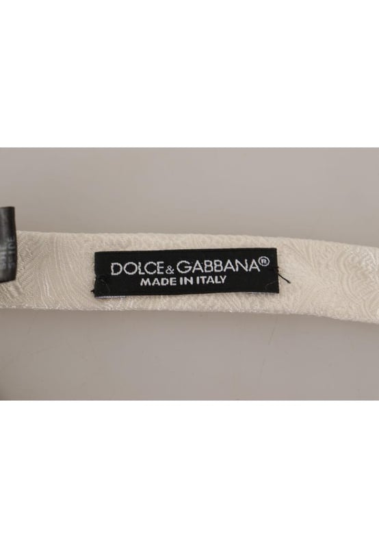 Color: White
  Model: Tied
  Material: 100% Silk
  Adjustable length neck strap one size
  Made In Italy
  Width: 4cm
Material: 100% Silk