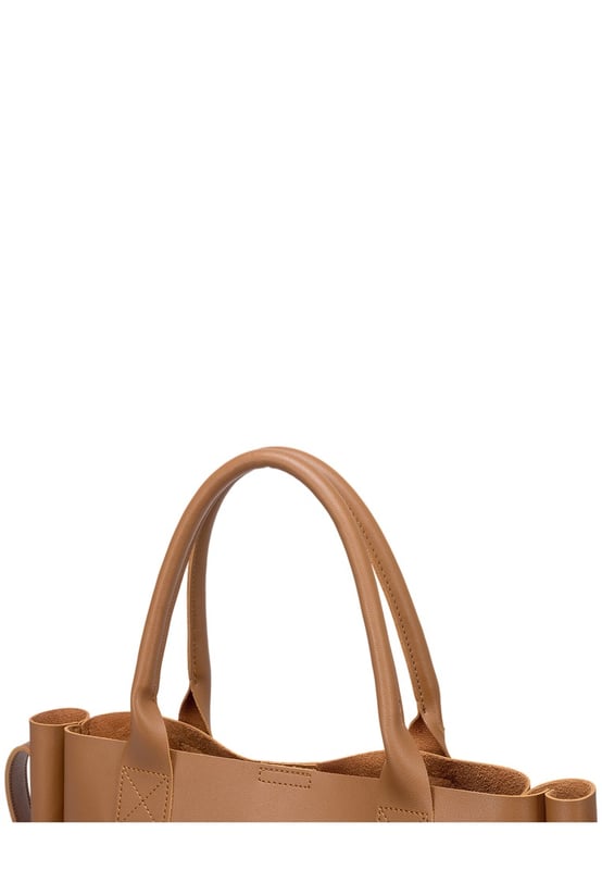 Be anything but basic with this classic wardrobe staple. The Megan XL Tote is the perfect accessory for making a statement and is highly functional too. Inside is a spacious compartment, big enough to carry the days essentials. You can also find a pouch which can be removed, ideal for storing items you want to keep extra secure, or use it as a mobile makeup bag! You have a choice of styling with the tote grab handles and the adjustable shoulder strap, so you can change your look depending on your chosen style! Features: , Lightly textured PU exterior, Claudia Canova debossed logo, Magnetic clasp fastening, Two exterior slip pockets, 2 x tote grab handles, Adjustable shoulder strap, Interior pouch which can be removed using the snap button clasps, Pouch measurement: W 304 x H 203 x D 63 mm, Zip top fastening on interior pouch Style Ref: 84607 TAN