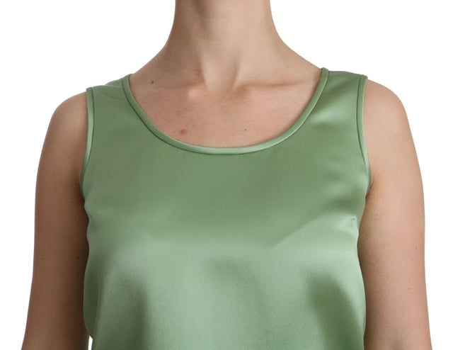 Dolce & Gabbana Sleeveless Silk Blouse with Logo Details
  Brand new with tags
  100% Authentic
  Material: 100% Silk
  Color: Green light mint
  Made in Italy
Material: 100% Silk