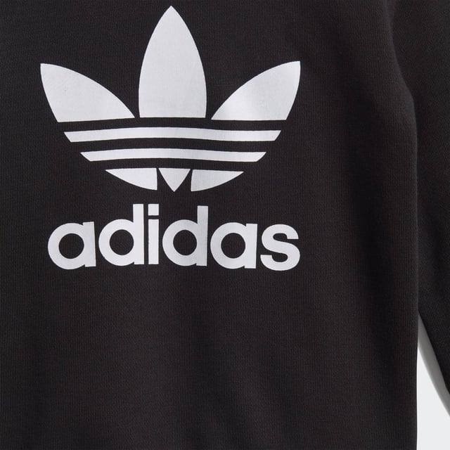 Dress them up in iconic sporty style. A big contrast Trefoil logo and 3-Stripes give this infants' outfit an authentic look. Both pieces are made of a cosy, soft French terry. Hidden shoulder snaps on the sweatshirt make it easy to slip on and off.  - Regular fit is not tight and not loose, the perfect in-between fit - Ribbed crewneck - Long sleeves with ribbed cuffs; Ribbed pants cuffs - 70% cotton, 30% polyester (recycled) - Pants: Side pockets; Drawcord on ribbed waist - adidas partner with the Better Cotton Initiative to improve cotton farming globally; This set is made with recycled polyester to save resources and decrease emissions - Sweatshirt: Snap-button placket on shoulder for easy on and off (up to size 86); Ribbed hem  Shipped by adidas