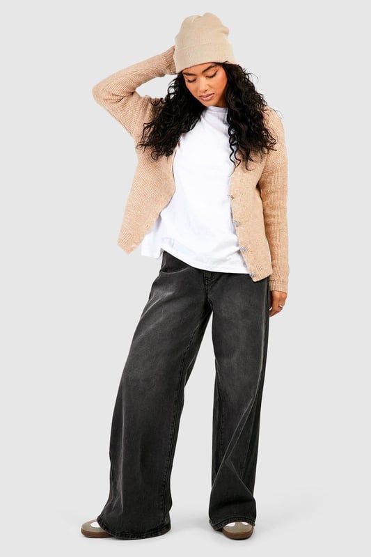 Soft knit texture for ultimate comfort
        Slouchy, relaxed fit for effortless style
        Eye-catching rhinestone buttons add a touch of glamour
        Versatile open-front design for easy layering
        Ribbed cuffs and hem for a polished finish
    
    Embrace laid-back luxury with this slouchy cardigan, perfect for the fashion-forward woman who values both style and comfort. The soft knit fabric drapes beautifully, creating a relaxed silhouette that's ideal for casual outings or cosy nights in. The standout feature is undoubtedly the sparkling rhinestone buttons, which add a subtle touch of glamour to this otherwise understated piece. Style it over a simple white tee and wide-leg trousers for a chic daytime look, or throw it on over a slip dress for an evening ensemble with a twist. For a trendy finish, pair with a beanie and chunky trainers as seen on our model. This cardigan is a versatile staple that will quickly become your go-to for family gatherings, coffee dates, or lazy weekends at home.