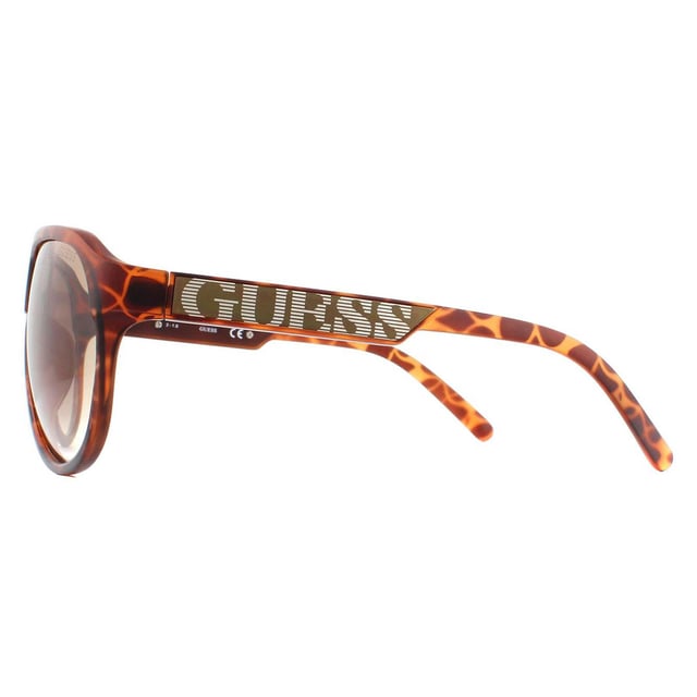 Las gafas de sol Guess GU6729 S57 Tortoise Brown Gradient son una montura de alta calidad hecha de plástico con forma de mosca y están diseñadas para hombres