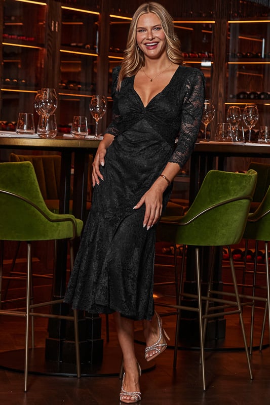 All of the impact, none of the effort Cut from luxurious lace with the perfect amount of stretch That twist neckline is so flattering Nipped-in waist falls to a dreamy tiered hem Framed by stunning sheer puff sleevesAdd some sparkle with jewelled accessories