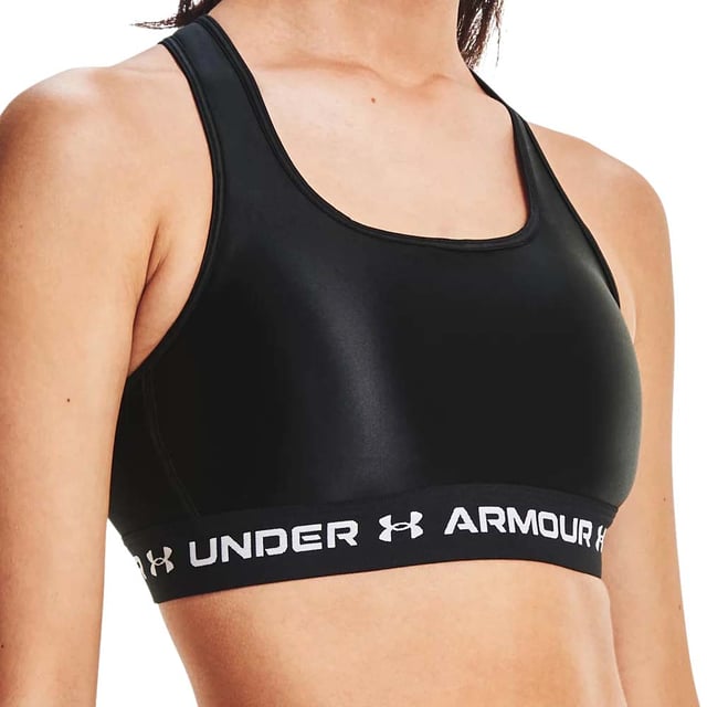The Under Armour Crossback Mid Matte Shine Womens Sports Bra is a styled out design that will turn heads as you work out.   This bra is made to deliver strategic support for medium impact activities such as cycling, weight training and boxing. The soft, quick-drying cups provide extra structure & coverage with perforations for added breathability. Removable cups have helpful R & L arrows to easily put back in. Crossover straps with updated keyhole detail for easier on/off access. Updated interior construction helps keep pads in place. Elastic band feels super-smooth & soft. Super-smooth, double-layer HeatGear fabric delivers superior next-to-skin feel. The Material wicks sweat & dries really fast to help keep you cool when working out.